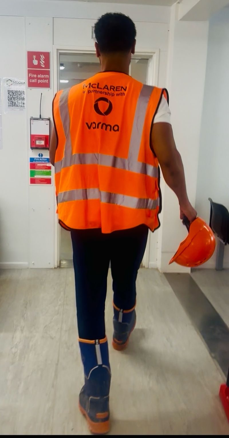 A Varma operative on site in a McLaren partnership hi-vis vest